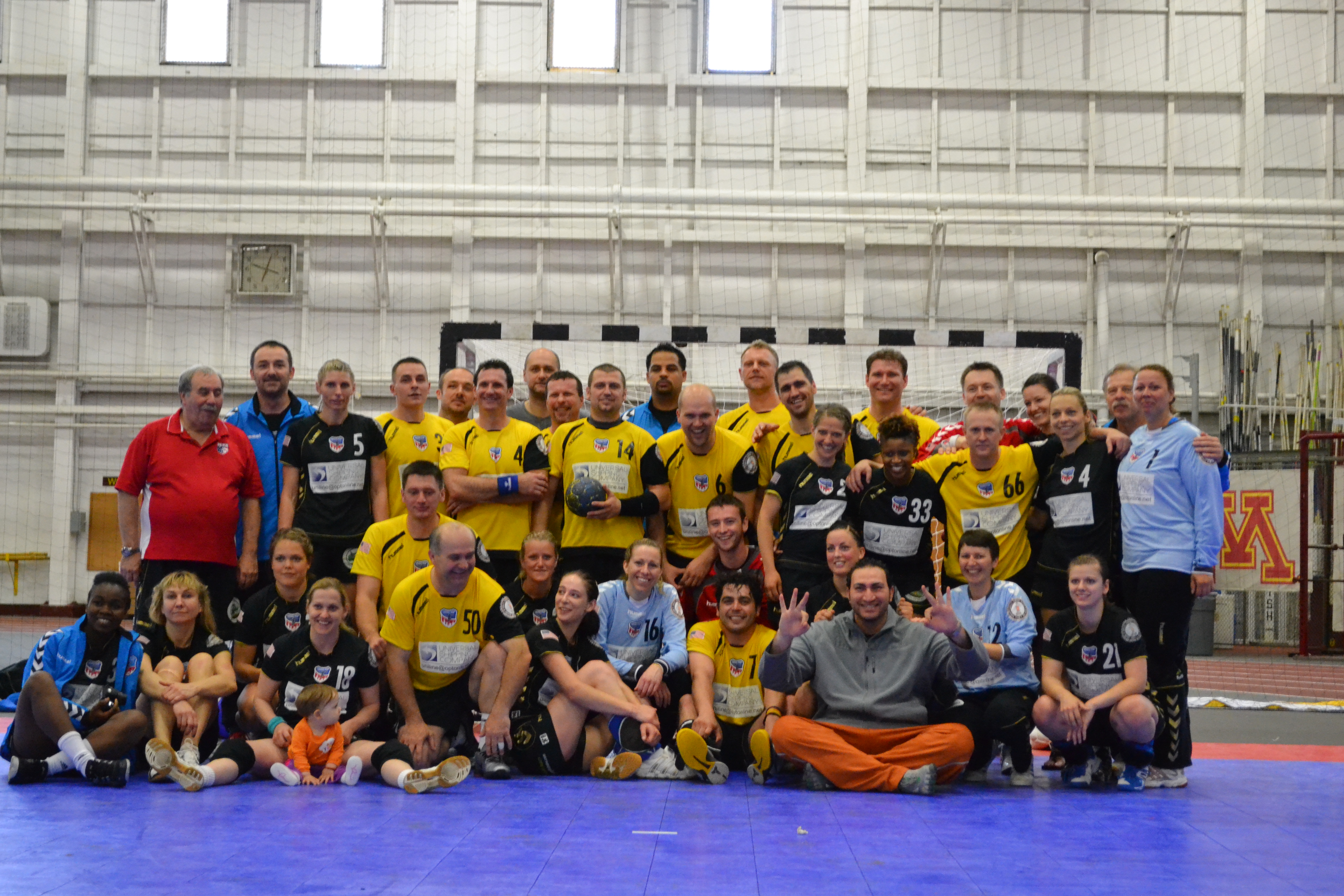 Both handball teams show off their medals